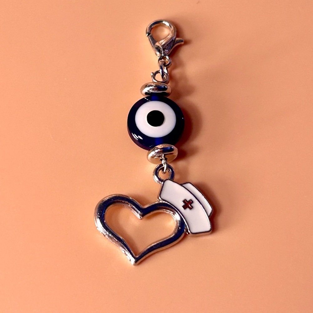 🧿🩵 Evil Eye Badge Reel Charm